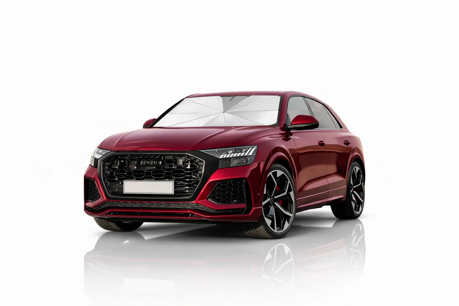 Red modern car with windshield sunshade umbrella opened to block sunlight and protect interior from heat damage